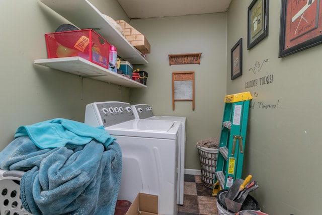 laundry area featuring laundry area, washing machine and clothes dryer, and baseboards