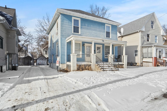 view of property with covered porch and cooling unit