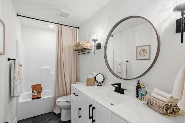 full bathroom featuring toilet, tile patterned flooring, vanity, and shower / bath combo with shower curtain