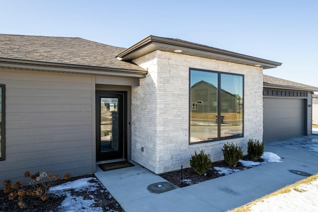 property entrance with a garage