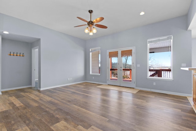 unfurnished room with french doors, ceiling fan, and dark hardwood / wood-style flooring