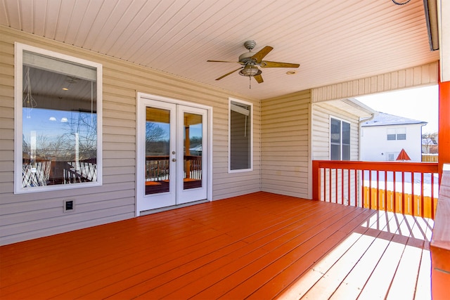 wooden deck featuring ceiling fan and french doors