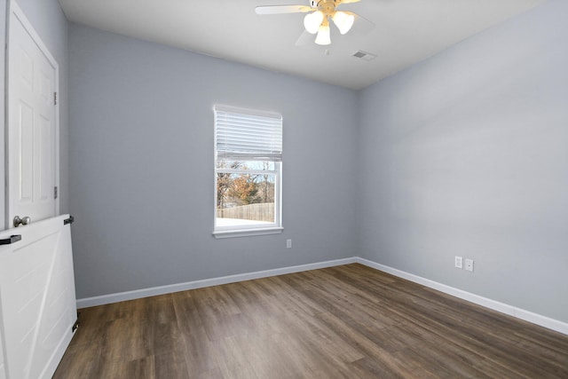 unfurnished room featuring dark hardwood / wood-style flooring and ceiling fan