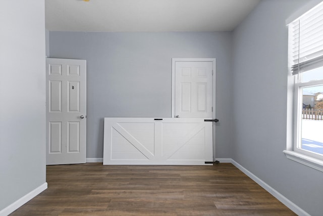 empty room featuring dark hardwood / wood-style floors