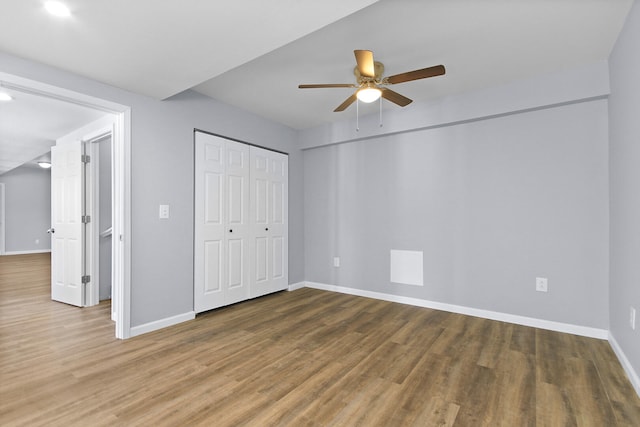 unfurnished bedroom featuring ceiling fan and hardwood / wood-style flooring