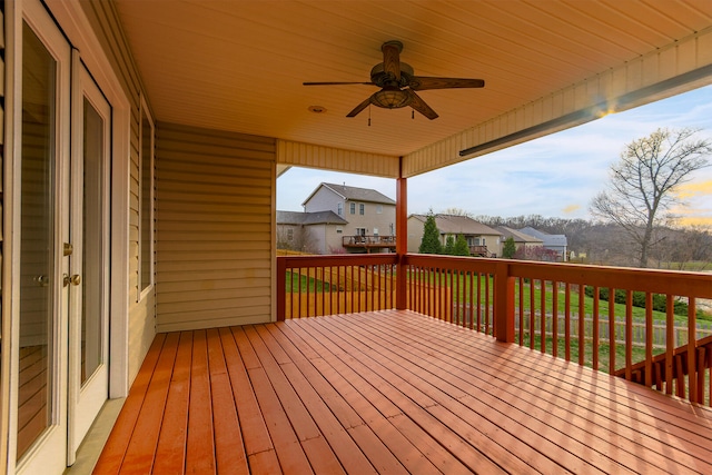 3103 Woods Crossing Dr, Columbia, MO 65202 - wooden deck featuring ceiling fan, a yard, and a residential view