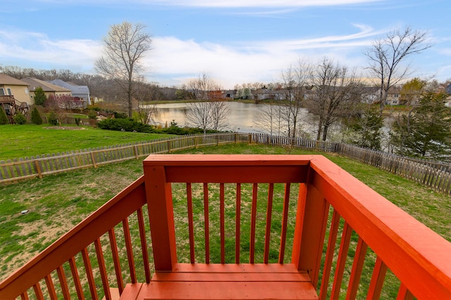 3103 Woods Crossing Dr, Columbia, MO 65202 - wooden deck featuring a lawn, a water view, a fenced backyard, and a residential view