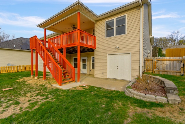 3103 Woods Crossing Dr, Columbia, MO 65202 - back of house with stairs, a patio area, fence, ceiling fan, and a yard