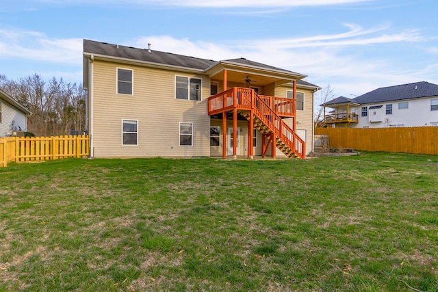 3103 Woods Crossing Dr, Columbia, MO 65202 - rear view of property with a wooden deck, ceiling fan, a fenced backyard, stairway, and a yard
