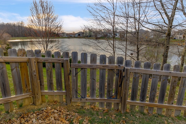 3103 Woods Crossing Dr, Columbia, MO 65202 - exterior space with a water view and fence