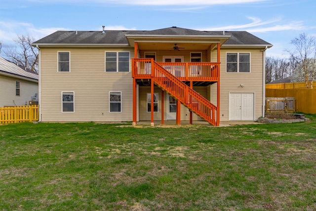 3103 Woods Crossing Dr, Columbia, MO 65202 - rear view of house with fence, ceiling fan, stairway, a deck, and a yard