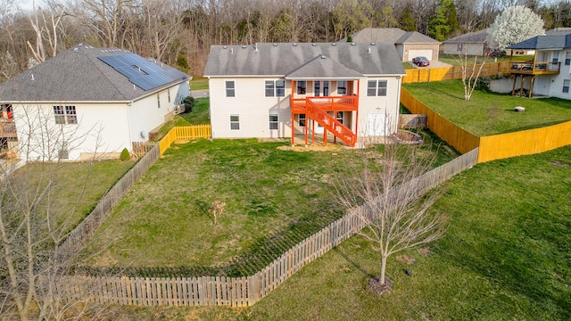 3103 Woods Crossing Dr, Columbia, MO 65202 - back of house featuring a fenced backyard, a deck, stairway, and a yard