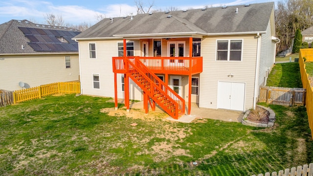 3103 Woods Crossing Dr, Columbia, MO 65202 - back of property with stairway, roof with shingles, a wooden deck, a fenced backyard, and a lawn