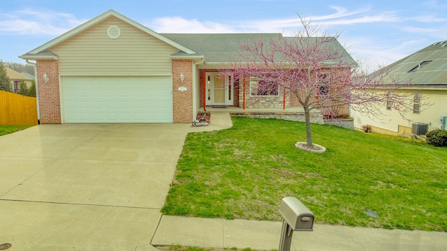 3103 Woods Crossing Dr, Columbia, MO 65202 - ranch-style home featuring concrete driveway, brick siding, a front lawn, central AC unit, and a garage