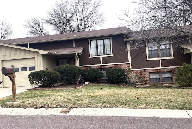 view of front facade featuring a front lawn, brick siding, and an attached garage