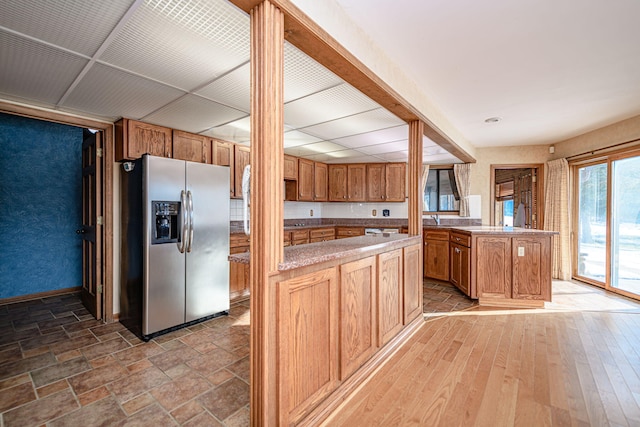 kitchen with stainless steel fridge and a center island