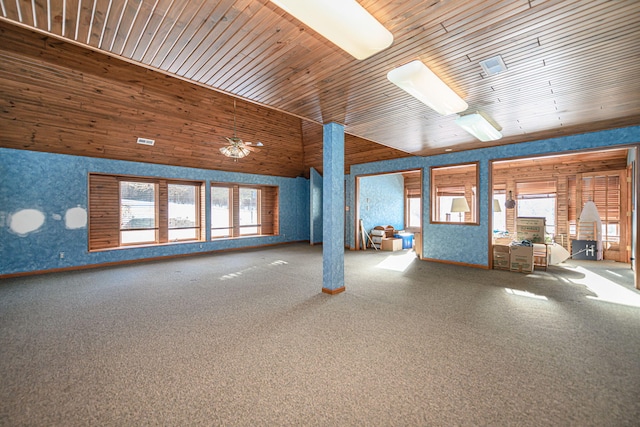 interior space with ceiling fan, wood ceiling, and carpet floors