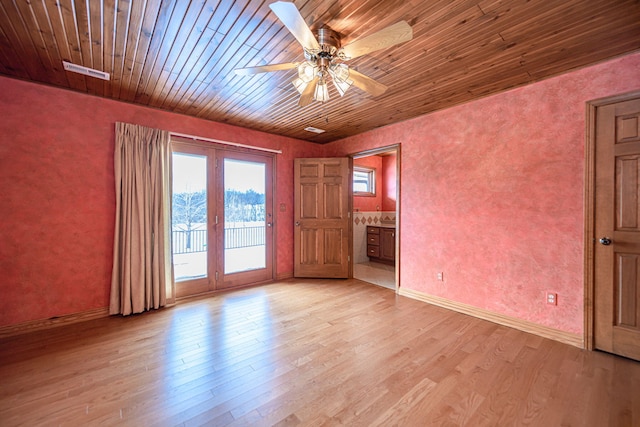 unfurnished room with light hardwood / wood-style floors, ceiling fan, wood ceiling, and french doors