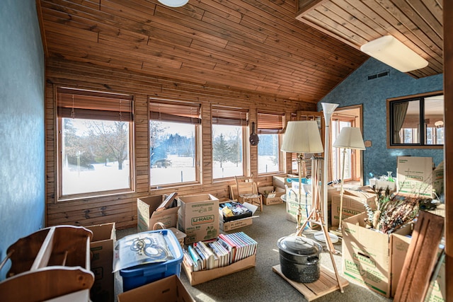 living room with wooden ceiling, carpet, and lofted ceiling