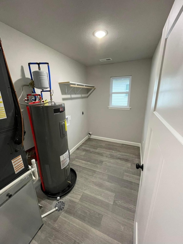 utility room featuring electric water heater