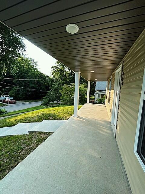 908 7th St, Boonville, MO 65233 - porch featuring a lawn