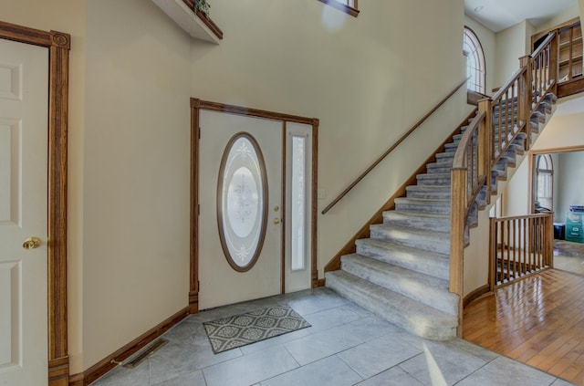 foyer with light tile patterned flooring