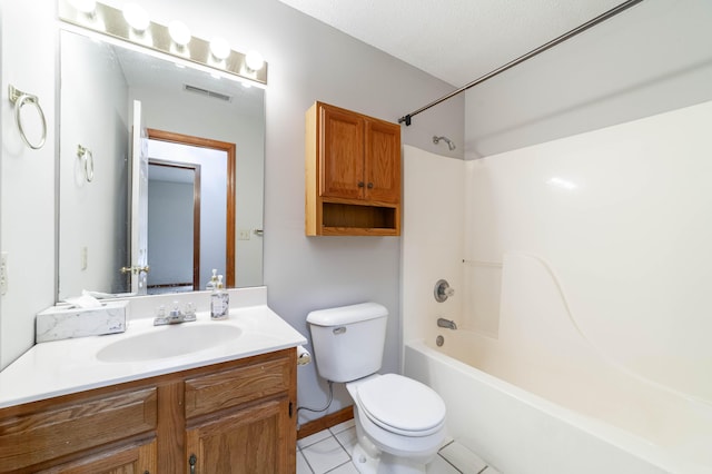 full bathroom featuring tile patterned flooring, toilet, vanity, a textured ceiling, and shower / bathing tub combination