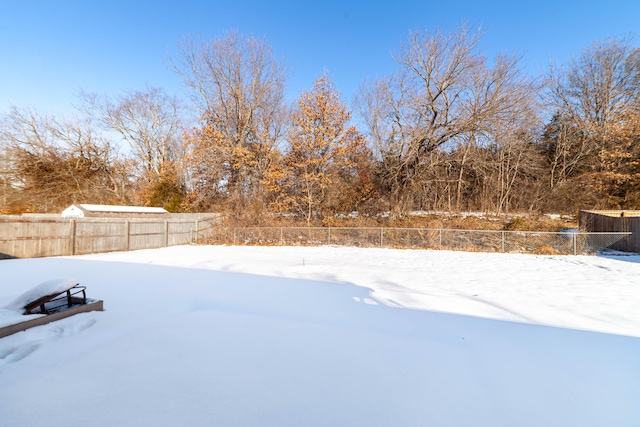 view of yard covered in snow