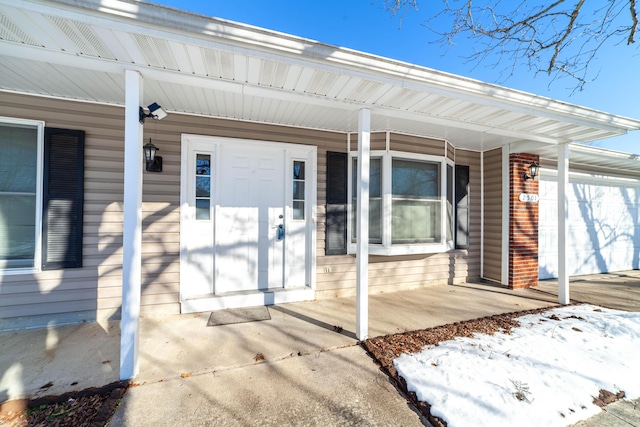 doorway to property featuring a porch