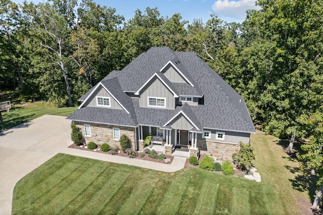 craftsman-style house with a front yard and covered porch