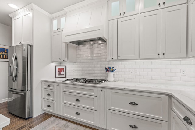 kitchen featuring custom exhaust hood, backsplash, white cabinets, dark hardwood / wood-style floors, and appliances with stainless steel finishes