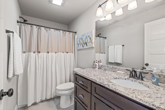 bathroom featuring a shower with shower curtain, vanity, and toilet