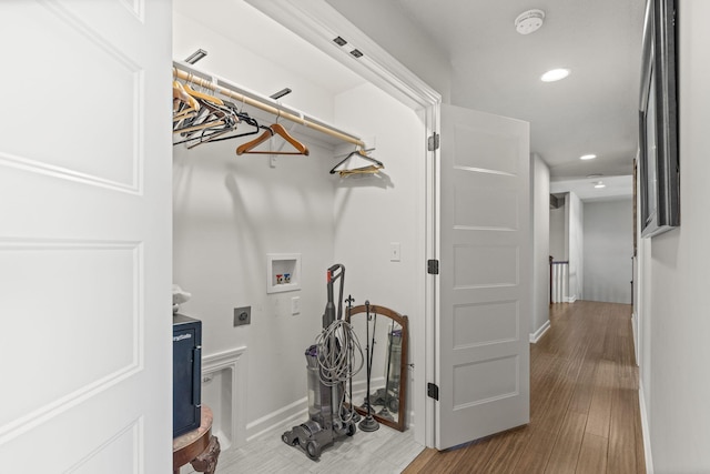 laundry room featuring washer hookup, hookup for an electric dryer, and hardwood / wood-style floors