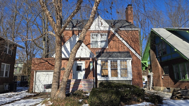 tudor home with a garage