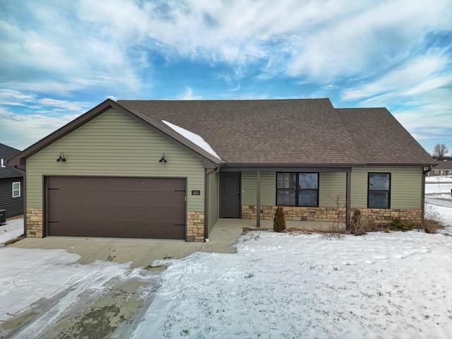 ranch-style home featuring a garage