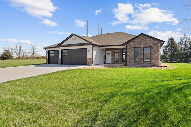 view of front of home with a front lawn and a garage