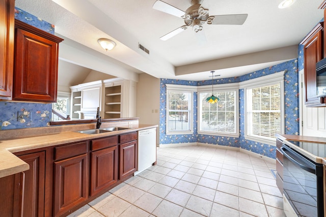 kitchen with pendant lighting, sink, white dishwasher, range with electric cooktop, and light tile patterned floors