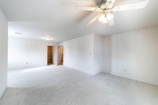 carpeted empty room with ceiling fan