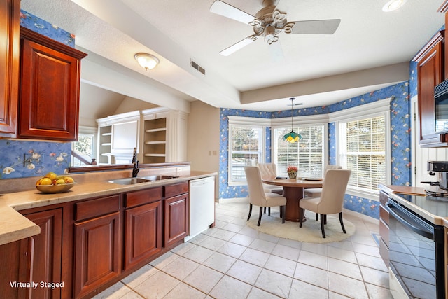 kitchen featuring ceiling fan, sink, white appliances, hanging light fixtures, and light tile patterned floors