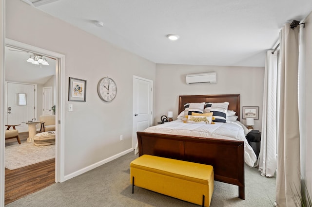 bedroom featuring carpet flooring and a wall mounted air conditioner