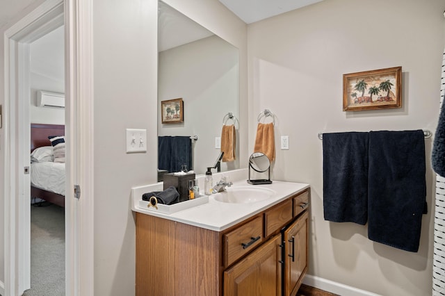 bathroom with vanity and a wall mounted air conditioner