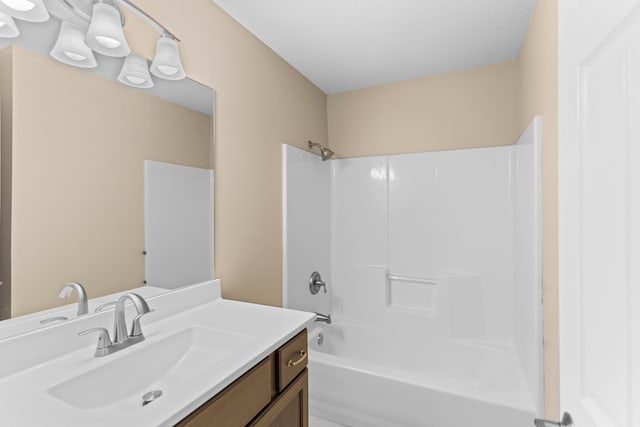 bathroom featuring vanity and bathing tub / shower combination