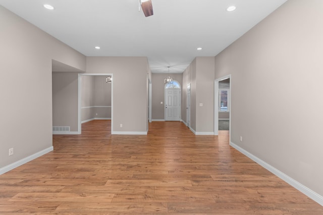 unfurnished room featuring ceiling fan and light hardwood / wood-style floors