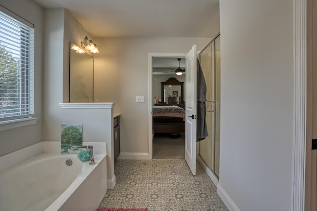 bathroom with shower with separate bathtub, vanity, and a wealth of natural light