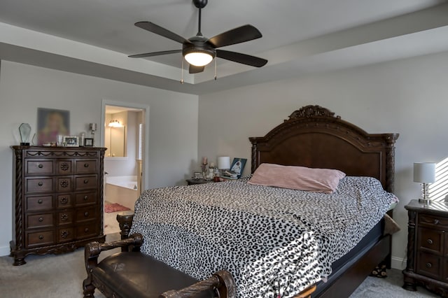 bedroom featuring ceiling fan, ensuite bathroom, and light carpet