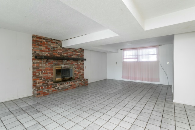 unfurnished living room with a textured ceiling and a fireplace