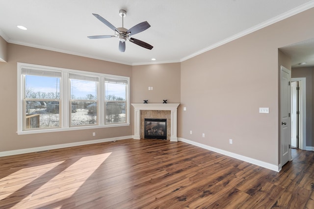 unfurnished living room featuring ceiling fan, dark wood-type flooring, and crown molding