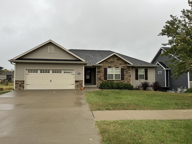 ranch-style home with a front lawn and a garage