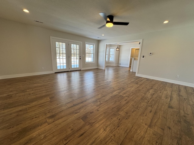 empty room with ceiling fan and dark hardwood / wood-style floors