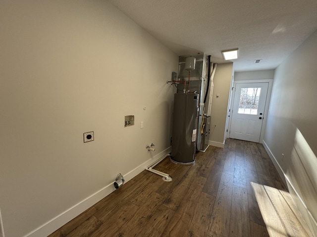 laundry area with water heater, dark hardwood / wood-style floors, hookup for a gas dryer, electric dryer hookup, and hookup for a washing machine